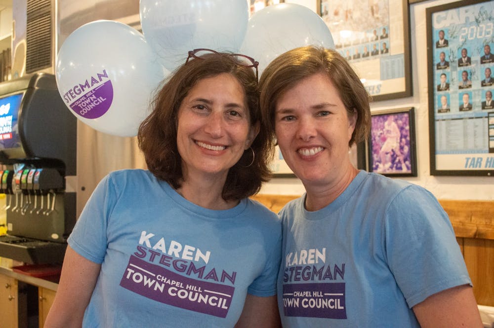 Council Member Karen Stegman smiles with her wife, Alyson Grine, at Italian Pizzeria III on Saturday June, 12, 2021, to celebrate Karen's reelection campaign.