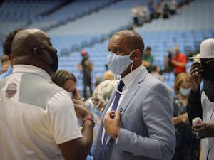 Hubert Davis socializes after his introductory press conference on Tuesday, April 6, 2021.
