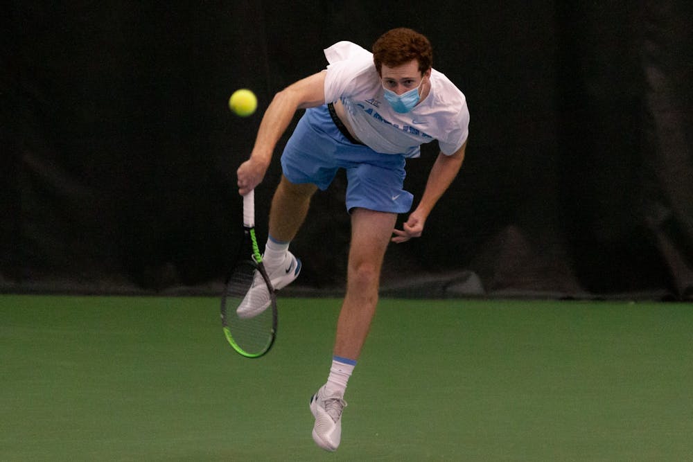 <p>Senior Henry Lieberman serves the ball during a match against Bucknell University at the Cone-Kenfield Tennis Center on Sunday, Jan. 23, 2022. The Heels won 7-0.</p>