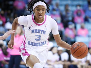 Sophomore guard Kennedy Todd-Williams (3) dribbles down the court to Louisville's basket. At halftime, UNC Women's Basketball is losing 32-37 against Louisville in Carmichael Arena on Thursday, Feb. 17, 2022