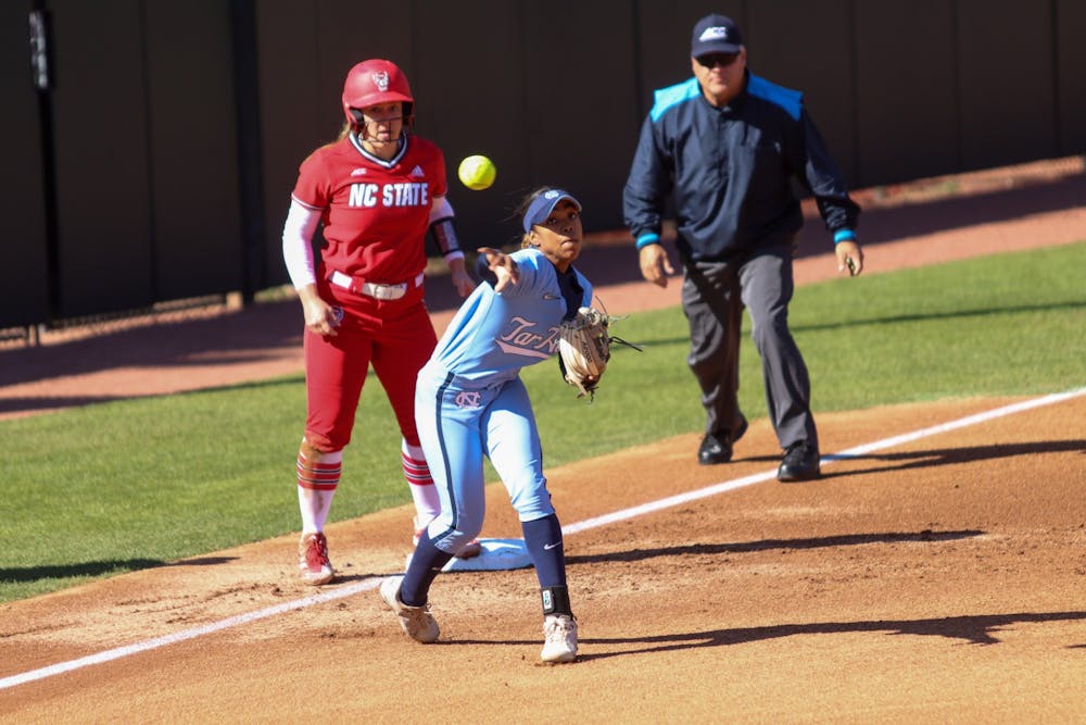 Third baseman Destiny Middleton (47) throws the ball towards first base for an out on Sunday, March 27, 2022. UNC beat N.C. State 16-4.