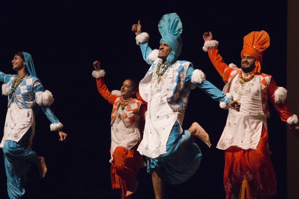 Dancers (from left to right) Alisha Abhayakumar, Aanchal Murjal, Benjamin Chilampath, and Ashwin Punj dance a traditional dance for Bhangra Elite at the Aaj Ka Dhamaka dance competition on Saturday, Nov. 17, 2018 in Memorial Hall at the University of North Carolina at Chapel Hill.  
