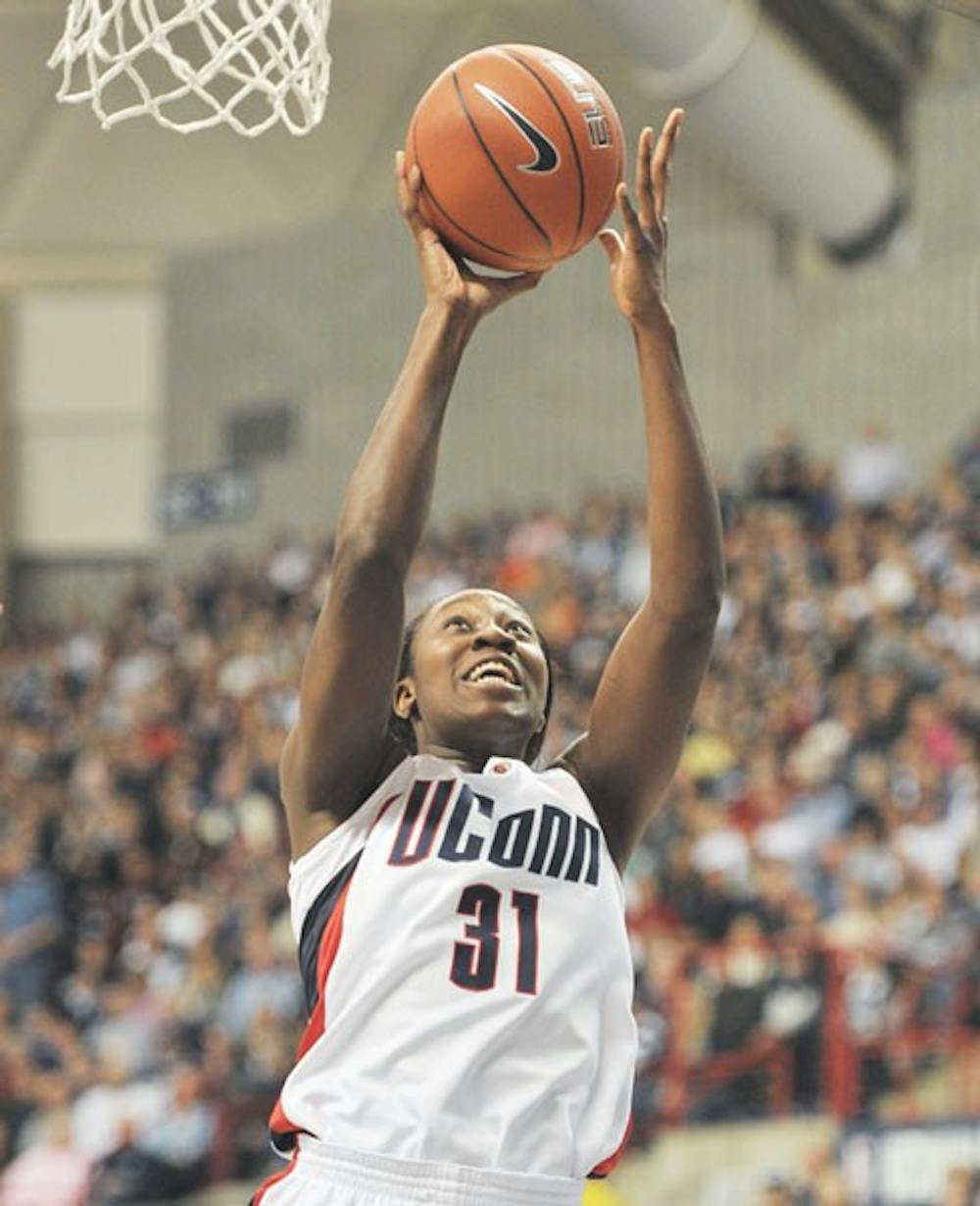 Center Tina Charles shot strong from the start, sinking all 25 of her points in the first half. Courtesy of The Daily Campus.