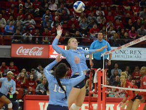 UNC's middle hitter Katharine Esterley (7) prepares to spike the ball during the game against N.C. State on Wednesday, Nov. 14. UNC lost to State 3-0. 