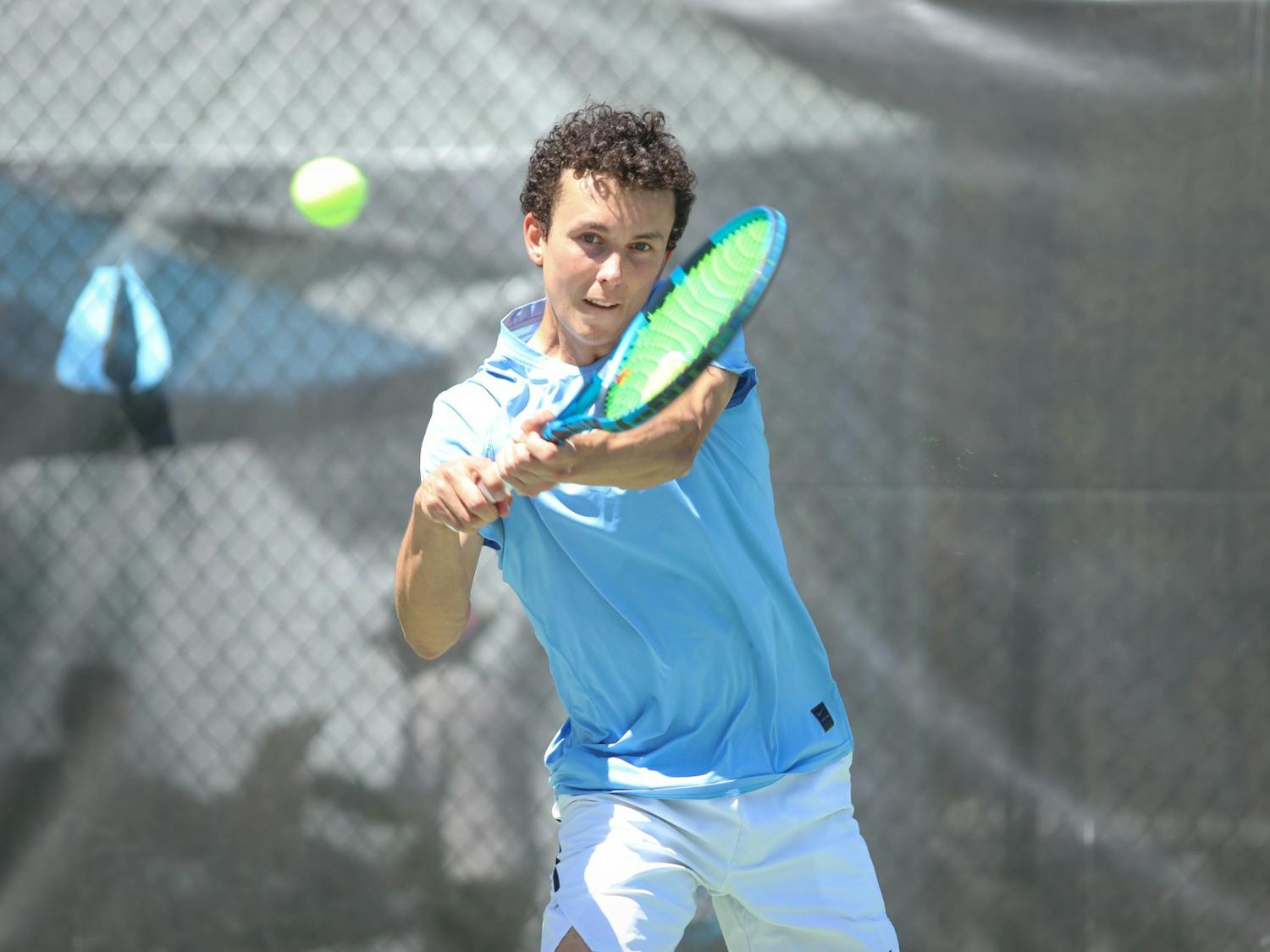 Sophomore Peter Murphy returns a volley with a backhand swing during his singles match. UNC beat Georgia Tech 7-0 on Sunday, April 3, 2022.