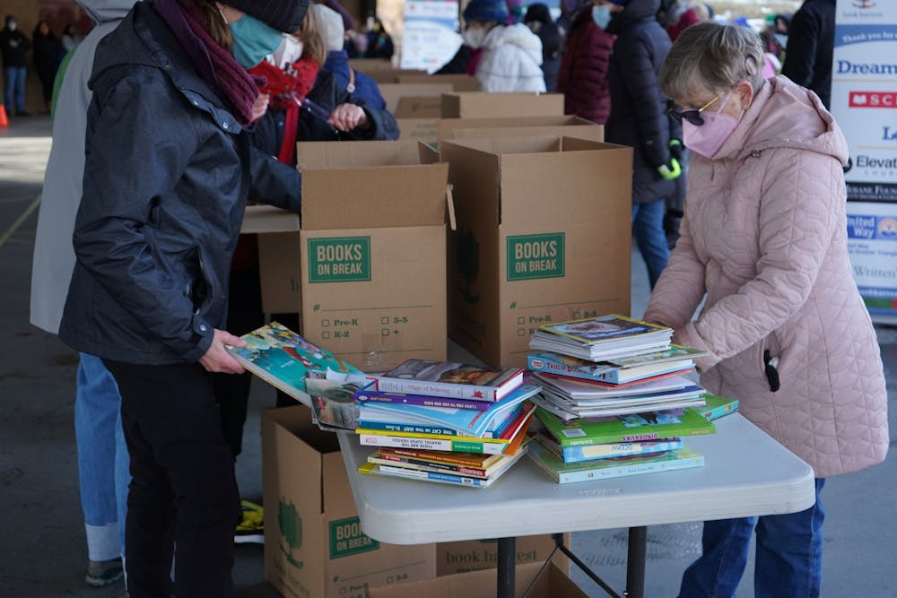 <p>Volunteers count books at the Dream Big Book Drive in Durham on Jan. 17, 2022. Photo courtesy of Benay Hicks.</p>