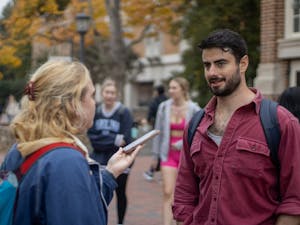 UNC first-year Lauren Rhodes interviews Daniel Goldstein, a junior exercise science major, in the Pit about what he is prioritizing this election cycle on Oct. 26, 2022.