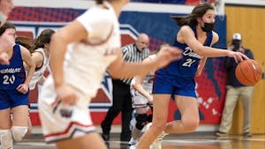 Ciera Toomey (21) dribbles the ball down the court during Dunmore High School's home game against Riverside High School on January 7th, 2022. Photo courtesy of Ciera Toomey.