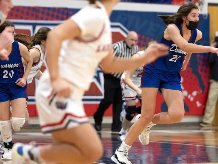 Ciera Toomey (21) dribbles the ball down the court during Dunmore High School's home game against Riverside High School on January 7th, 2022. Photo courtesy of Ciera Toomey.