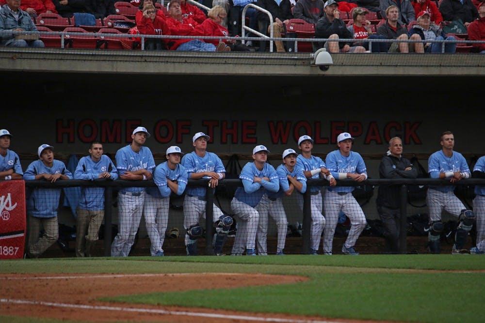 The UNC baseball team watches the game from the dugout at Doak Field in Raleigh, during the first of three games against NC State.