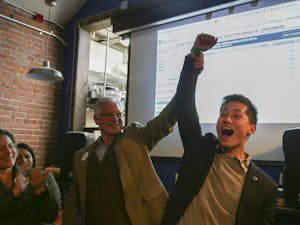 UNC student and Chapel Hill Town Council candidate Tai Huynh celebrates at a local election watch party on Tuesday, Nov. 5, 2019.