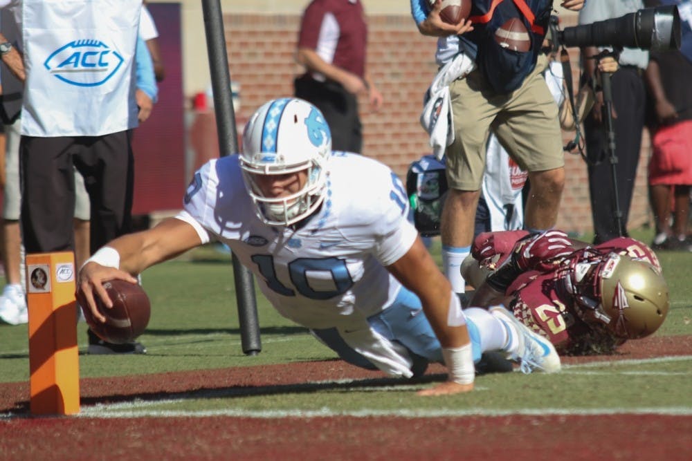 Former North Carolina quarterback Mitchell Trubisky (10) dives for a touchdown against Florida State in 2016.