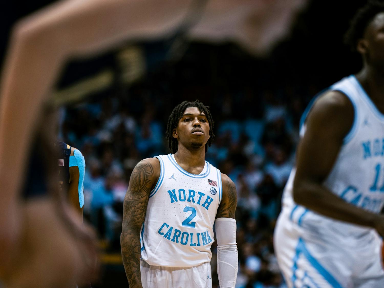UNC junior Caleb Love (2) watches sophomore teammate D'Marco Dunn (11) take a free throw at the men's basketball game against Notre Dame on Saturday, Jan. 7, 2023. UNC won 81-64 at the Dean Smith Center.