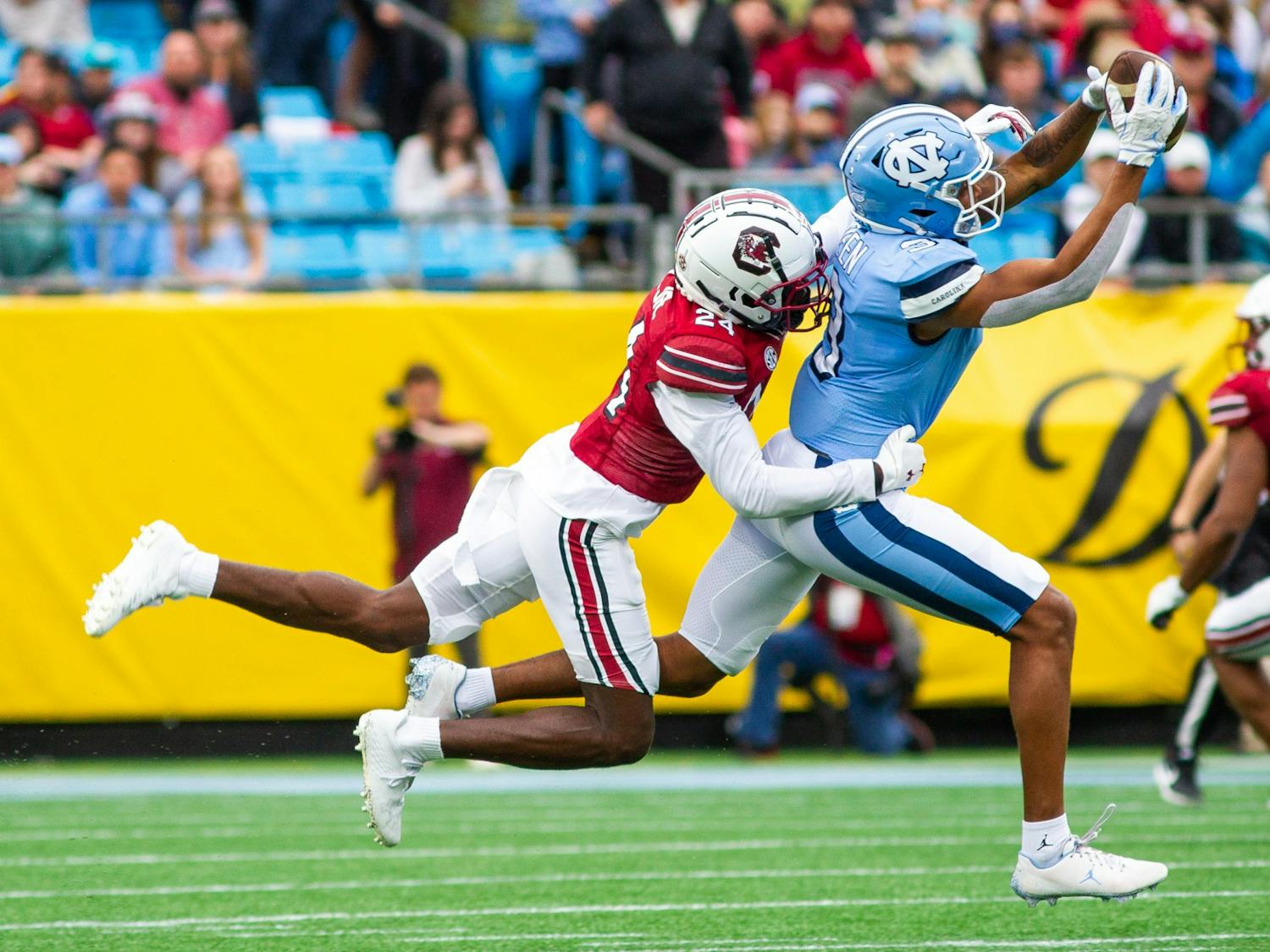 Senior wide receiver Antoine Green (3) catches the ball at the Duke's Mayo Bowl against South Carolina at the Bank of America Stadium in Charlotte on Dec. 30, 2021. UNC lost 21-38.