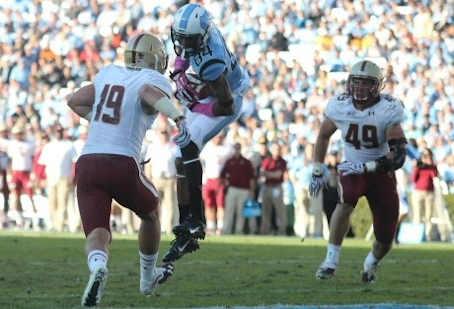 UNC wide receiver Bug Howard (84) catches a pass for a touchdown in a game against Boston College. Howard finished the 2014 football season with 42 catches and 455 yards with 2 touchdowns.