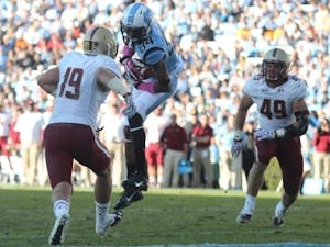 UNC wide receiver Bug Howard (84) catches a pass for a touchdown in a game against Boston College. Howard finished the 2014 football season with 42 catches and 455 yards with 2 touchdowns.