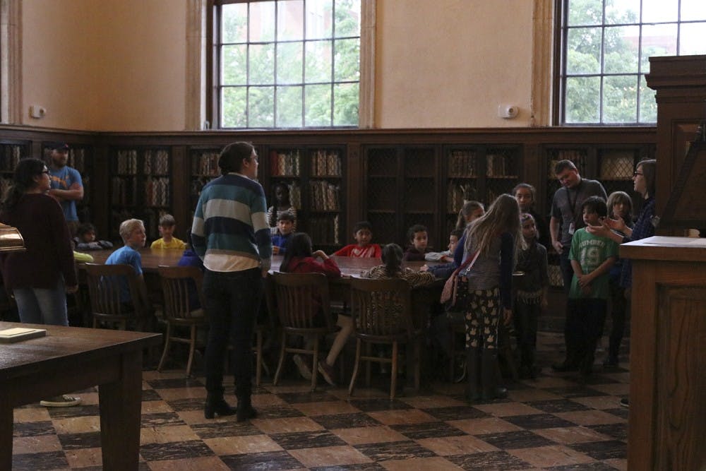 Elementary students from Frank Porter Graham Bilingual Elementary learn about Wilson Library during their campus tour on Tuesday. 