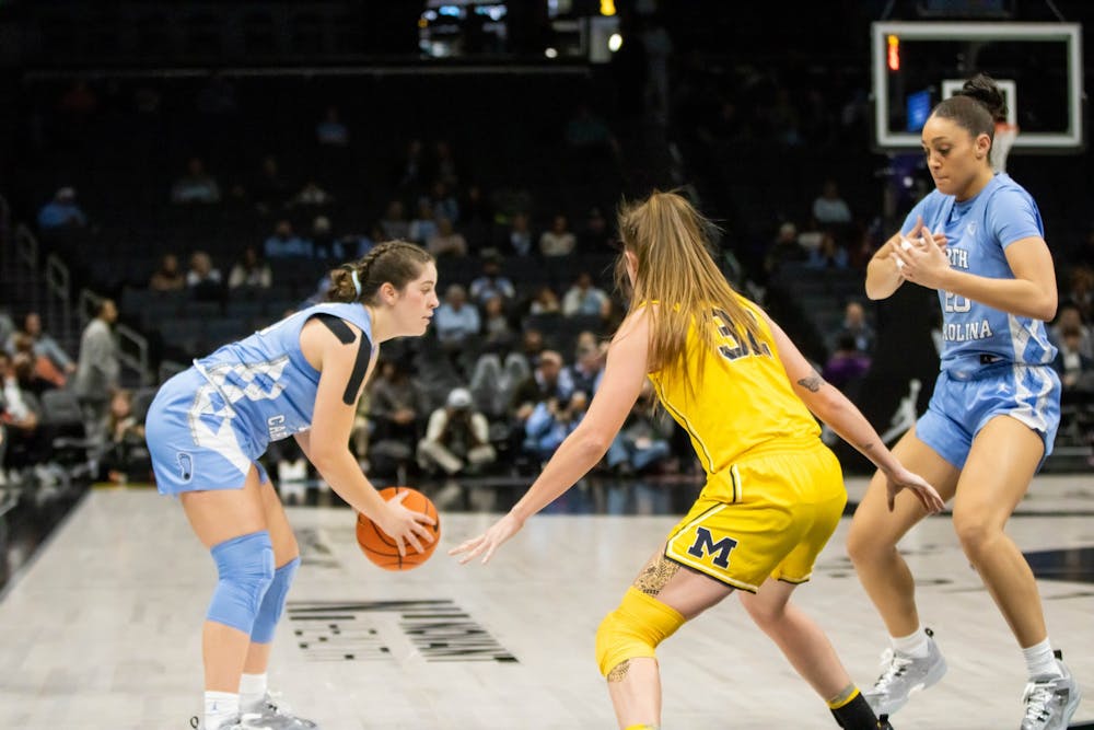 UNC senior guard, Eva Hodgson (10), looks for an opening during the game against Michigan at the Spectrum Center in Charlotte, N.C., on Tuesday Dec. 20, 2022. UNC fell to Michigan 76-68.