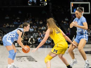 UNC senior guard, Eva Hodgson (10), looks for an opening during the game against Michigan at the Spectrum Center in Charlotte, N.C., on Tuesday Dec. 20, 2022. UNC fell to Michigan 76-68.