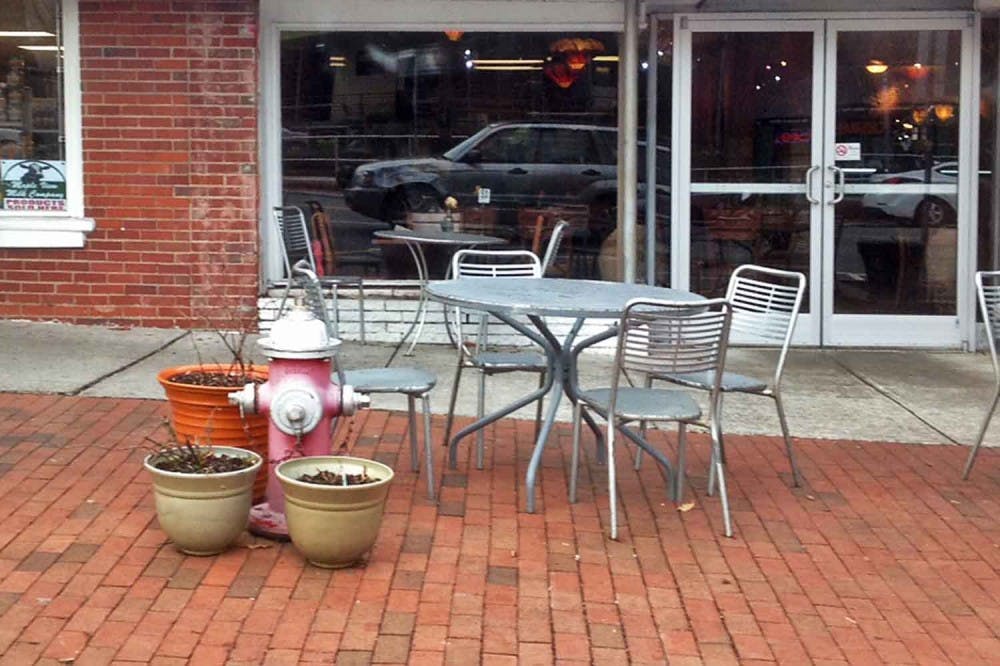 Chapel Hill resident Michael Holland received a ticket for parking in front of the fire hydrant in front of Mediterranean Deli. He says the hydrant was camouflaged by flower pots and faded paint. Courtesy of Michael Holland. 