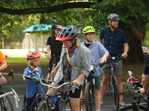 A group of Carrboro residents — including Mayor Damon Seils — participate in Queer Ride Carrboro’s “Ride Into Pride” event on May 31, 2023.