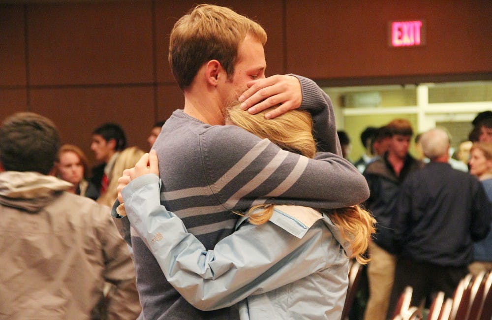 David's brother Stephen Shannon embraces a UNC student after the vigil.