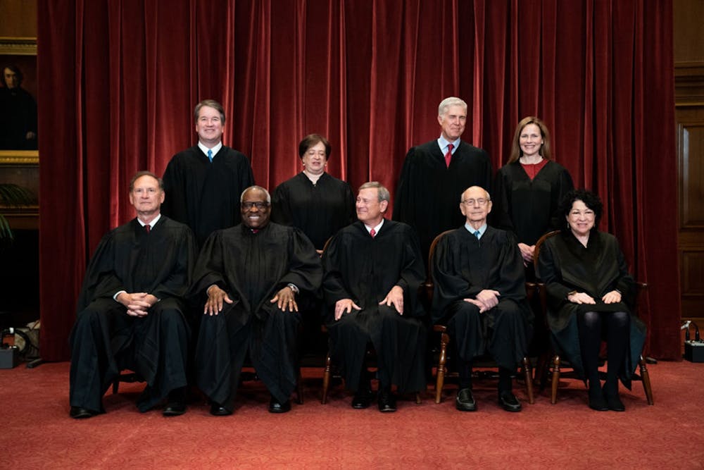 Members of the Supreme Court pose for a group photo at the Supreme Court in Washington, DC on April 23, 2021. Seated from left: Associate Justice Samuel Alito, Associate Justice Clarence Thomas, Chief Justice John Roberts, Associate Justice Stephen Breyer and Associate Justice Sonia Sotomayor, Standing from left: Associate Justice Brett Kavanaugh, Associate Justice Elena Kagan, Associate Justice Neil Gorsuch and Associate Justice Amy Coney Barrett. Photo courtesy of Erin Schaff-Pool/Getty Images/TNS.