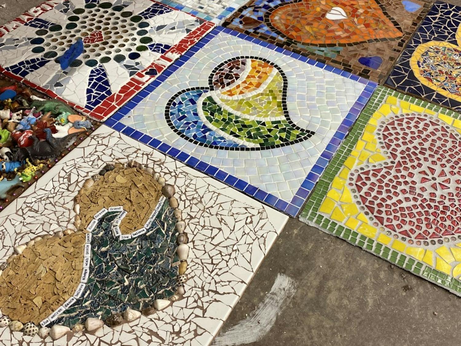 Carlos González García, a mosaicist new to the Hillsborough area, combined over 150 mosaics made by community members this summer as part of the #LoveHillsborough Community Art Project. Photo courtesy of Carlos González García.&nbsp;