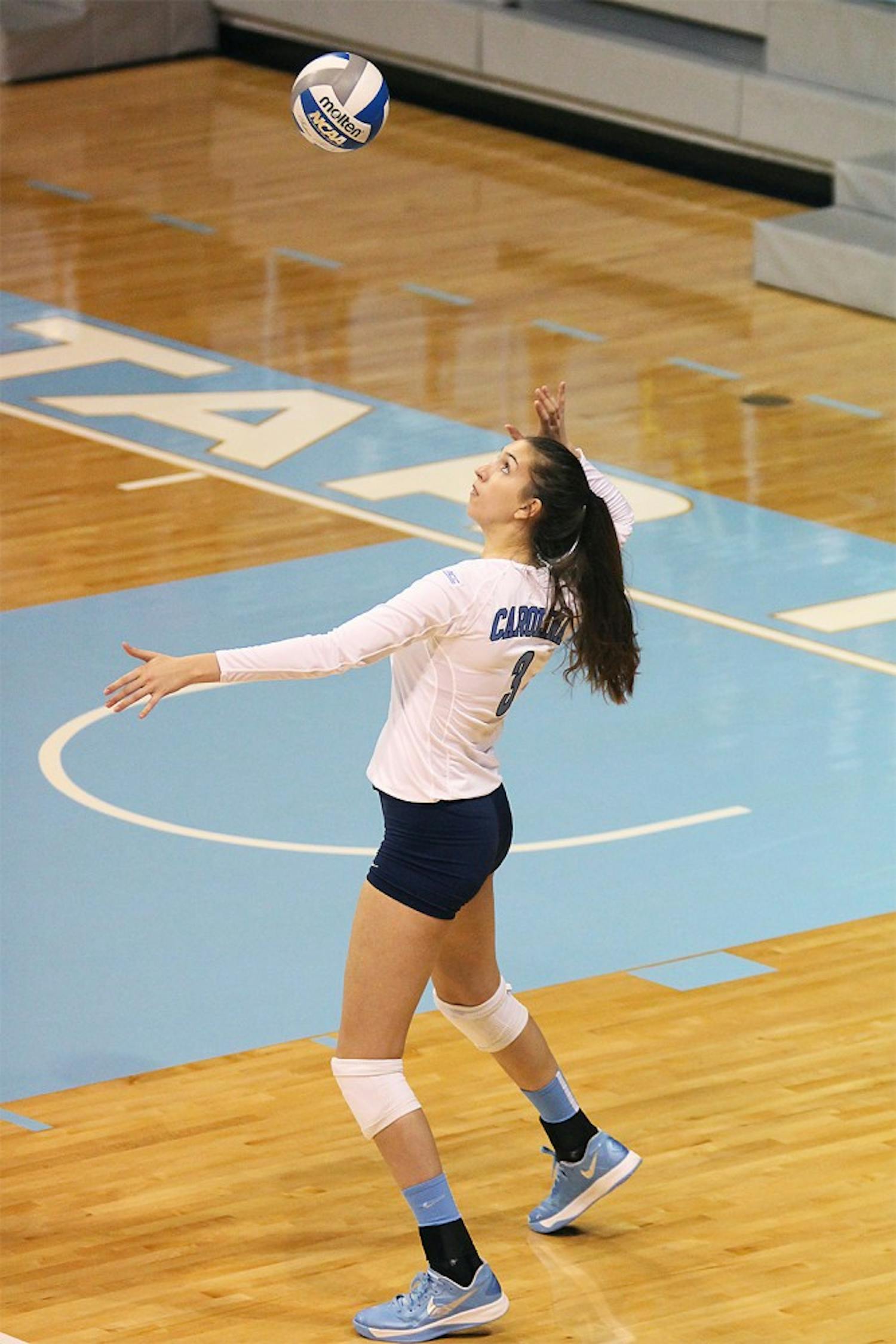 Freshman middle blocker Beth Nordhorn serves the ball during the Tar Heel's victory over NC State.  Nordhorn finished the match with two blocks and one kill.