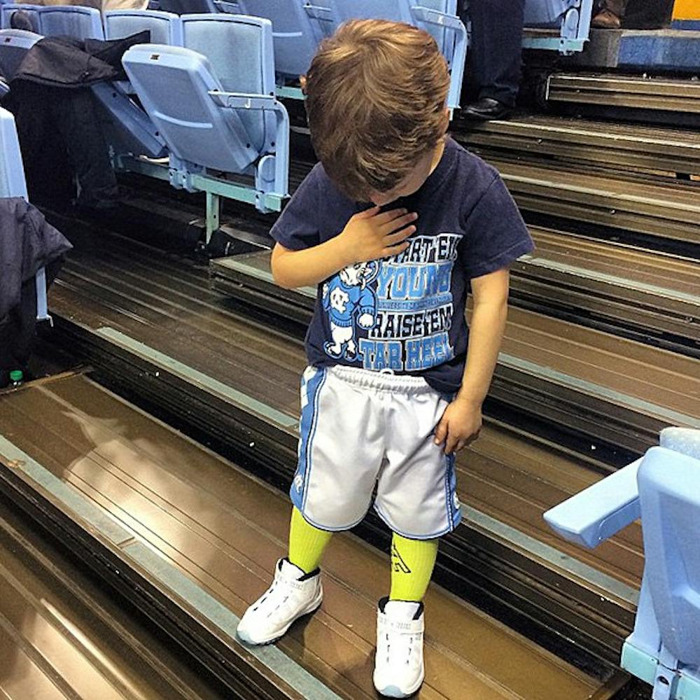 <p>Brady Hoots, 3, became an internet hit recently after a video of him at a UNC men’s basketball game was shared more than 6,000 times. Courtesy of Eric Hoots.</p>