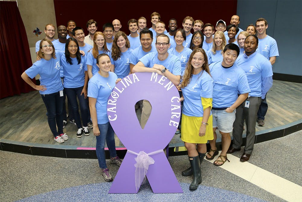 <p>UNC School of Medicine students show their support for Carolina Men Care and its mission to increase the discussion on interpersonal violence. Courtesy of Graham Mulvaney.</p>