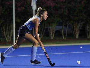 First-year forward Ashley Sessa (3) looks for an open pass. UNC beat Duke 4-1 away on Saturday, Aug. 20, 2022.