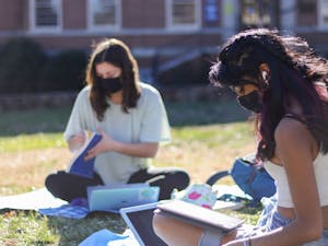 Sophomore students Naomi Nice and Megha Iyer study on Polk Place on Feb. 25, 2021.