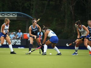 Erin Matson (1), surrounded by Duke players, reaches for ball in a game that UNC won 2-0, marking their 33rd consecutive victory.