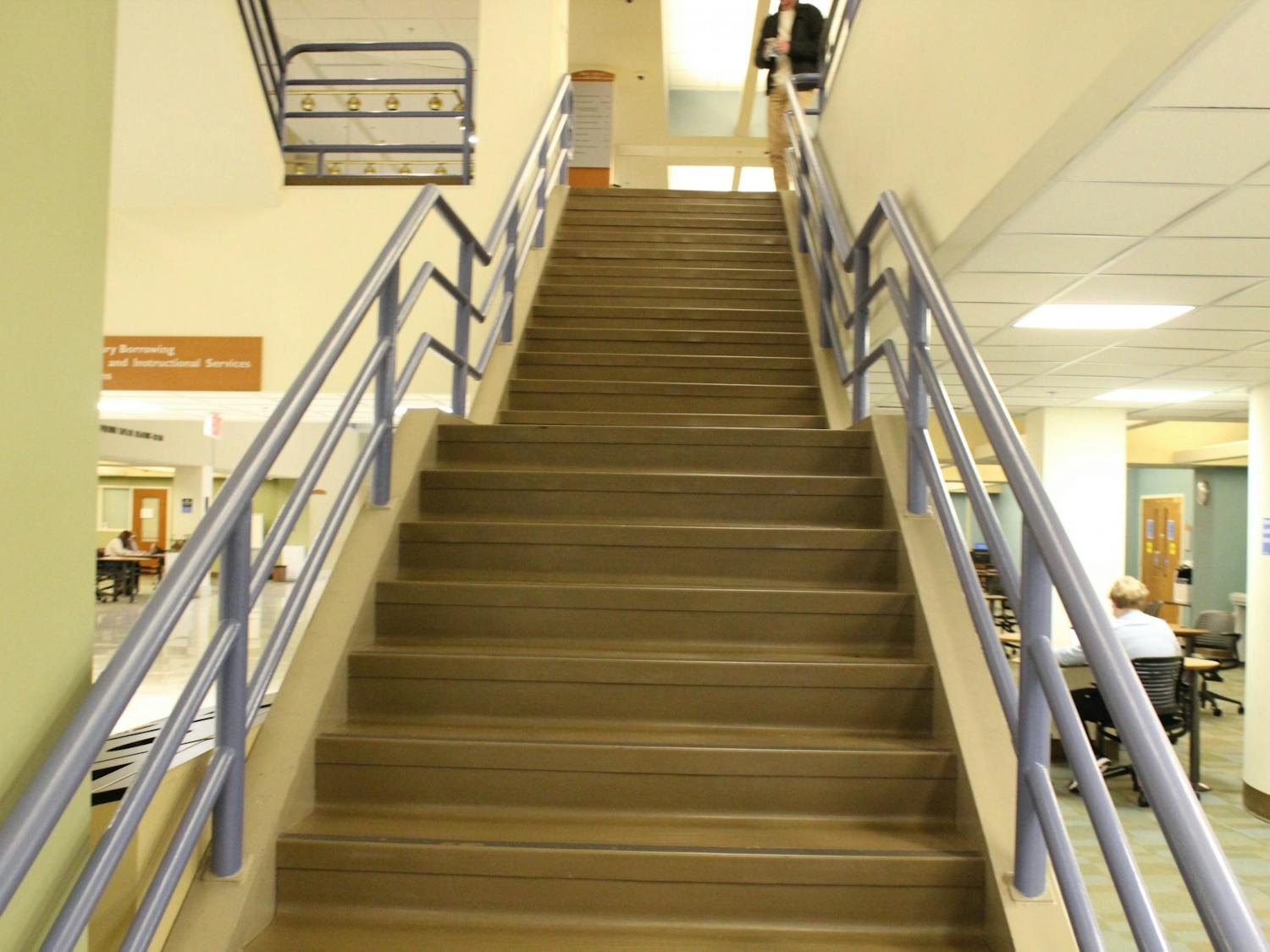 The stairs from the first floor to the second floor of Davis Library are pictured on Monday, Jan. 10, 2022. On the night before final exams, many students streak down these stairs and out to the Pit. 
