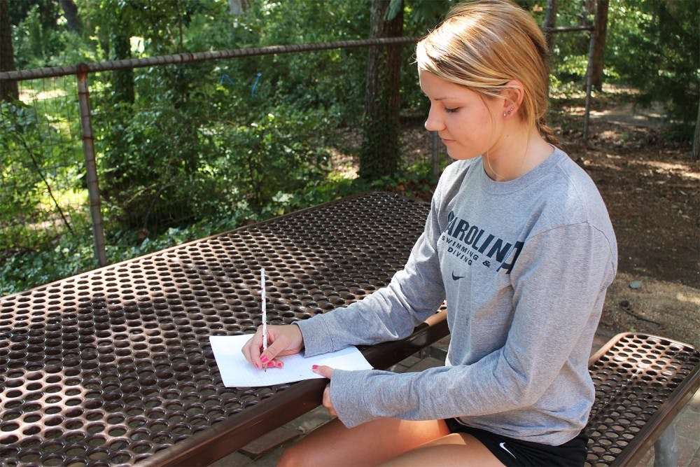 Katie Ford is one the women's swimming and diving team and also has a passion for drawing. 