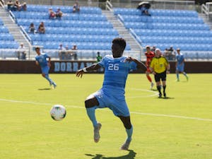 Senior forward Jelani Pieters (26) prepares to kick the ball during a game against Syracuse at Dorrance Field on Saturday, Oct. 12, 2019. The Tarheels lost 3-4.