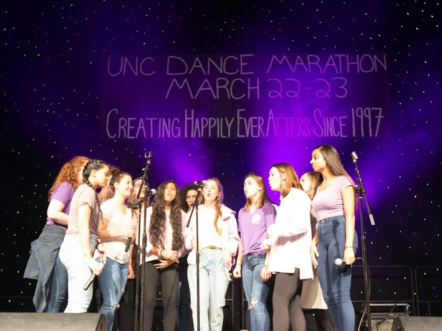 UNC Cadence A Cappella performs at the UNC Dance Marathon. Carolina For The Kids Foundation hosted the marathon, a no-sitting, no-sleeping event comprised of over 2,000 students who remain standing for 24 hours at Fetzer Gym, on March 22 and March 23, 2019.  The event is a culmination of year-long fundraising efforts which raised $440,955.07. The money raised goes toward providing families with financial and emotional assistance at UNC Children's Hospital. Students who attended the marathon watched the basketball game between UNC and Iona, danced, watched musical performances and more. Students participated in the marathon for a various personal reasons, including having their own family members in the hospital or,  "seeing how much of an impact we can have on a family," said Jessica Martinson, a junior and biology major. 