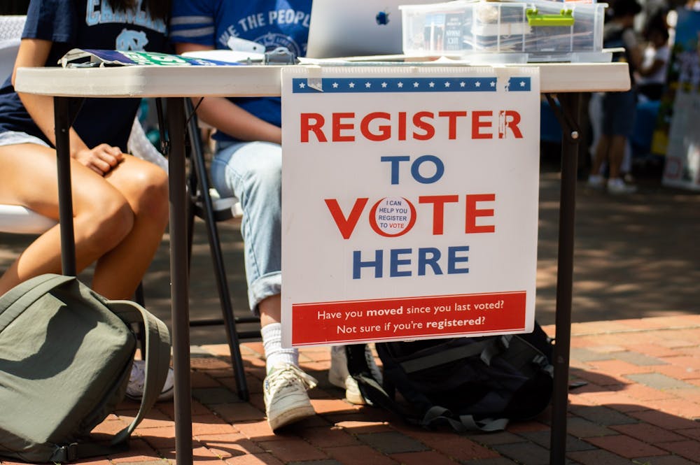 Students table in the pit, offering to register voters on Sept. 15, 2022.