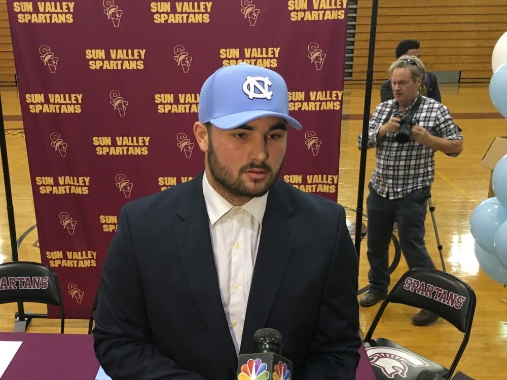 <p>Sun Valley quarterback Sam Howell addresses the media after committing to UNC. Howell is North Carolina's all-time leader in total offense, with over 17,000 yard passing and rushing.</p>