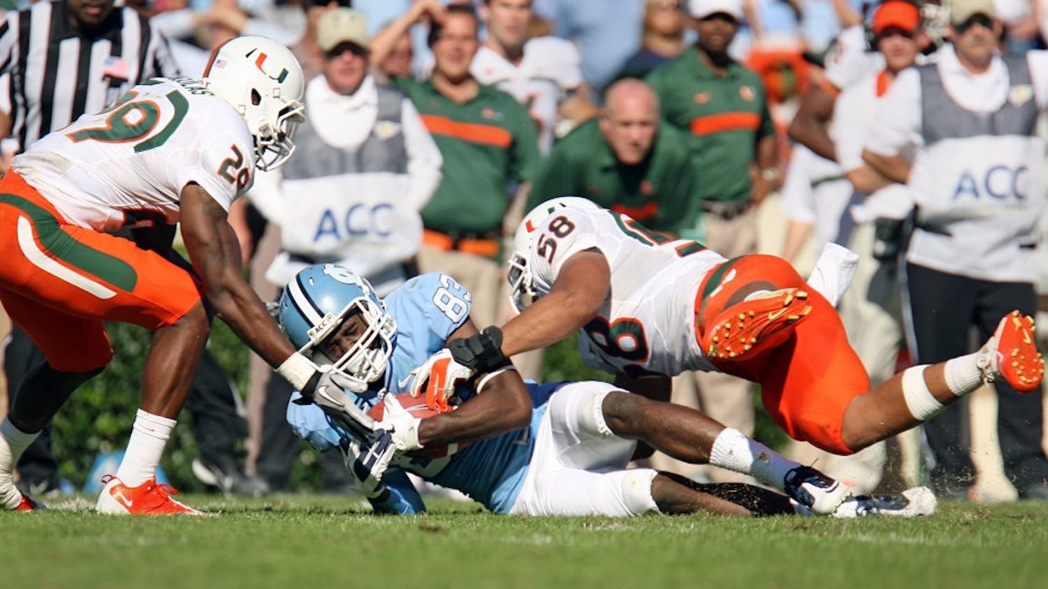 UNC wide receiver Dwight Jones is brought down by Miami's defense in the game on Saturday. UNC lost to Miami 30-24. 