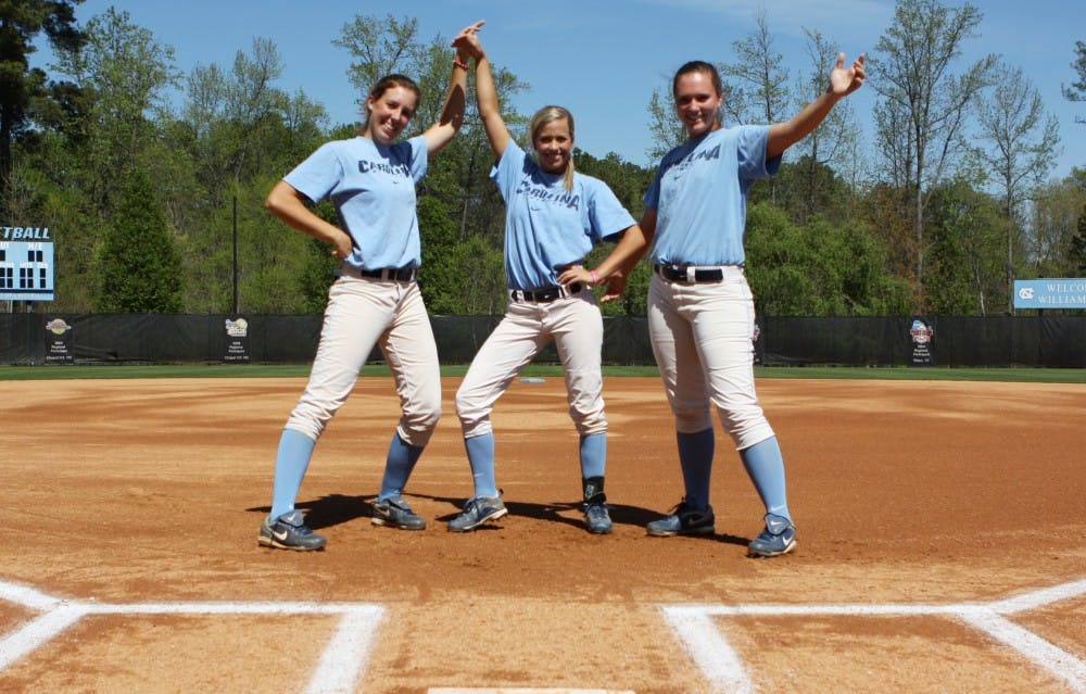 UNC women’s softball players get ready to play with walk