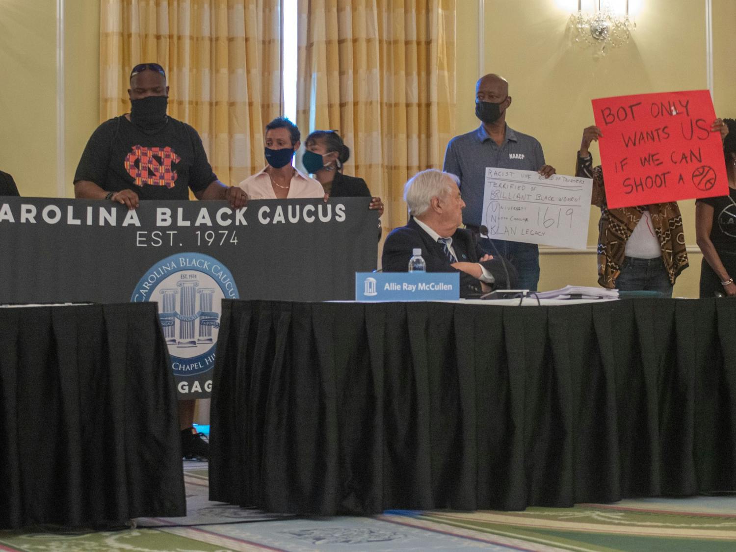 Members of the Carolina Black protest the UNC decision to deny tenure to Nikole Hannah-Jones at the UNC Board of Trustees meeting at the Carolina Inn on Thursday May 20, 2021.