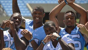 Quinshad Davis, Bug Howard, Damien Washington and Devin Perry posing for the camera.