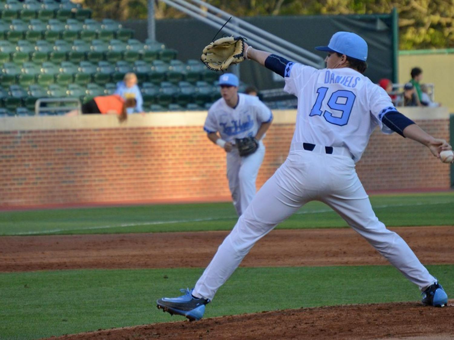 Sophomore Brett Daniels (19) pitches the ball during the game against Davidson College on Tuesday. The Tar Heels won 10-2.
