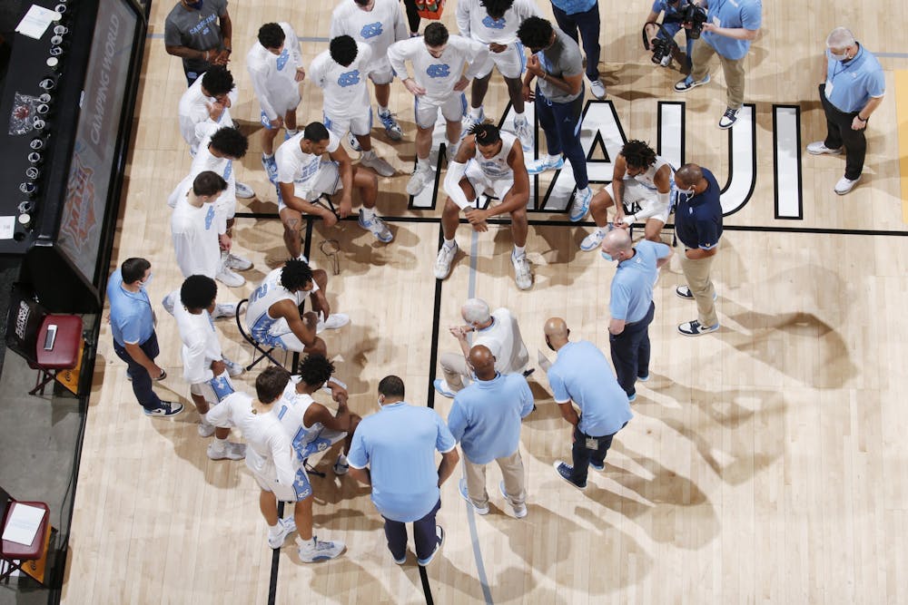 UNC men's basketball team talks during a time-out of the championship game of the Maui Invitational Tournament in Asheville, N.C. on Wednesday, Dec. 2, 2020. UNC lost the championship to Texas 69-67. Photo courtesy of Brian Spurlock/Camping World Maui Invitational.