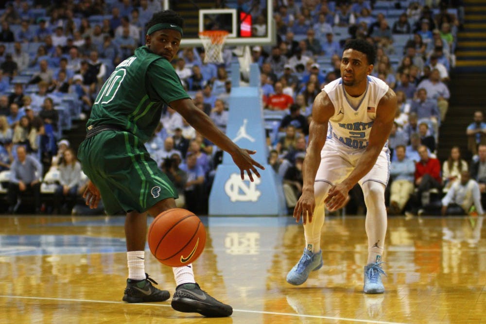 Joel Berry passes the ball to a teammate. Berry had a career-high nine assists during Wednesday's game against Tulane.
