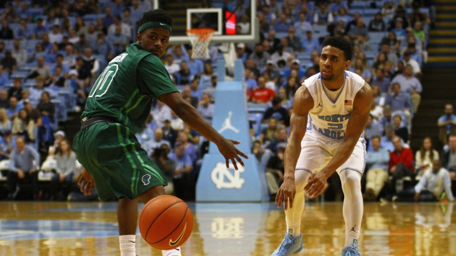 Joel Berry passes the ball to a teammate. Berry had a career-high nine assists during Wednesday's game against Tulane.
