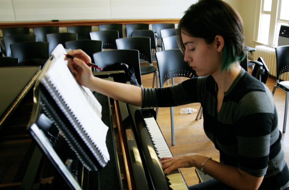 	<p>Trinity Velez works in Hill Hall on her latest composition, a complex, eight-voice choral piece. Velez hopes to eventually work in Hollywood composing film scores.</p>