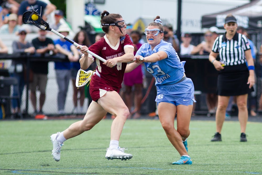 Fifth year defender Emma Trenchard (23) defends fifth year attacker Charlotte North (8) during UNC's NCAA National Championship Final against Boston College at Homewood Field in Baltimore, Md. on Sunday, May 29, 2022. UNC won 12-11.